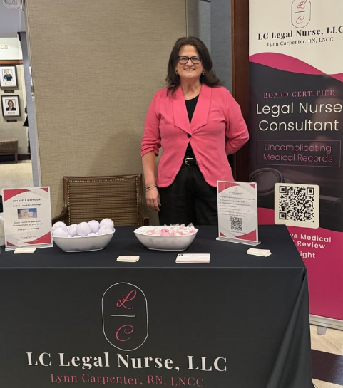 Lynn Carpenter, RN, LNCC, founder of LC Legal Nurse, at a client education table